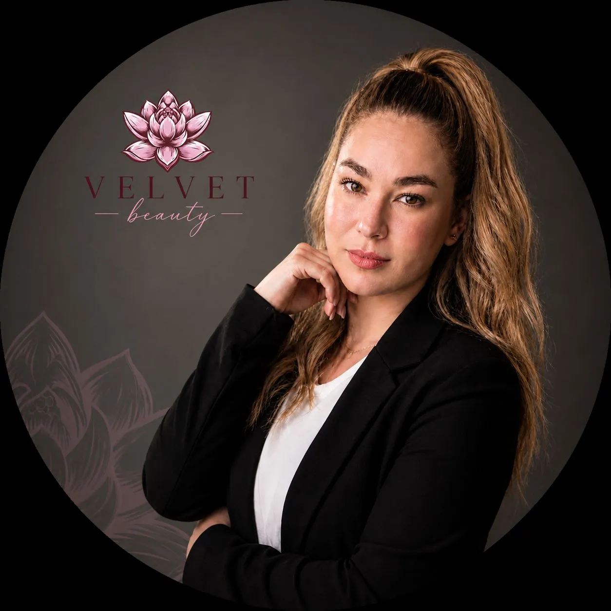 Velvet Beauty brand image: lotus flower logo and a woman in a black blazer